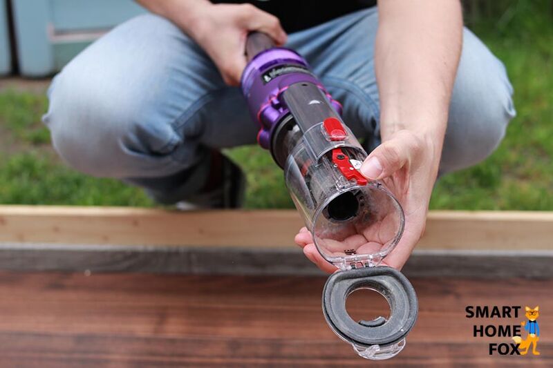 The red lever for removing the dirt container